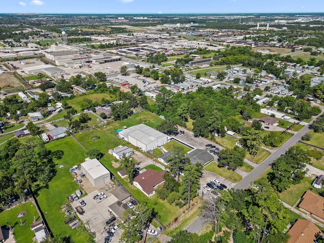 an aerial view of residential houses with outdoor space