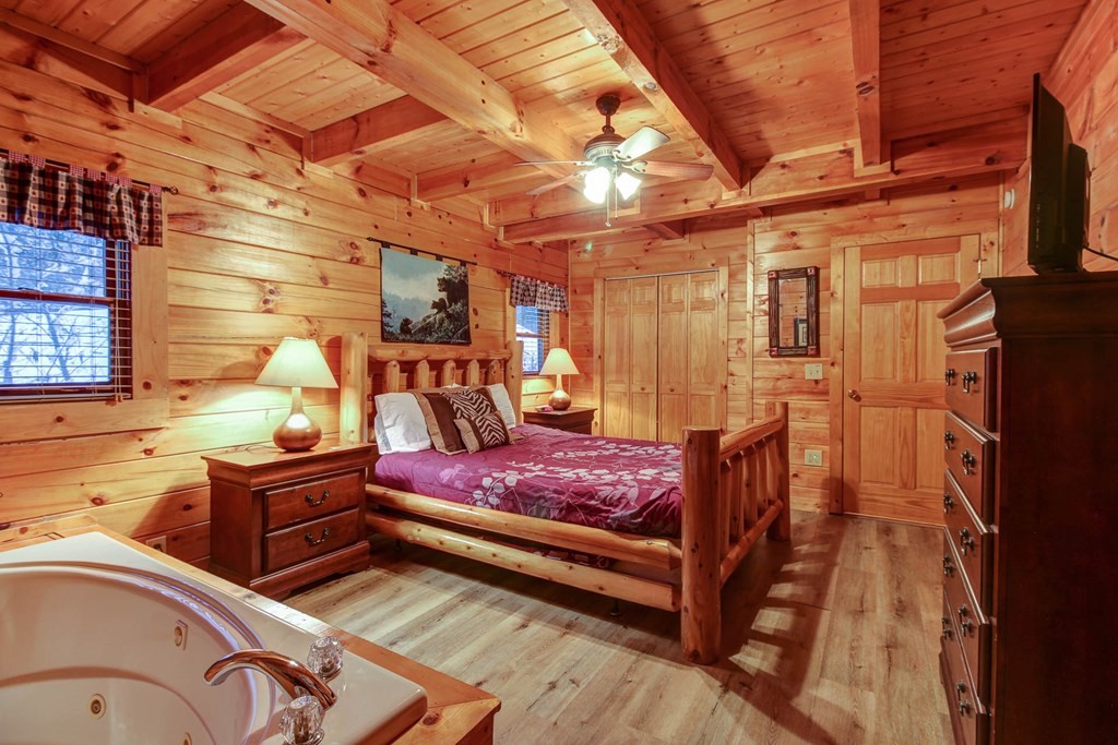 2010 Goose Gap Road Sevierville, TN 37876 - Photo 16 of 33 a bedroom with a bed and wooden furniture