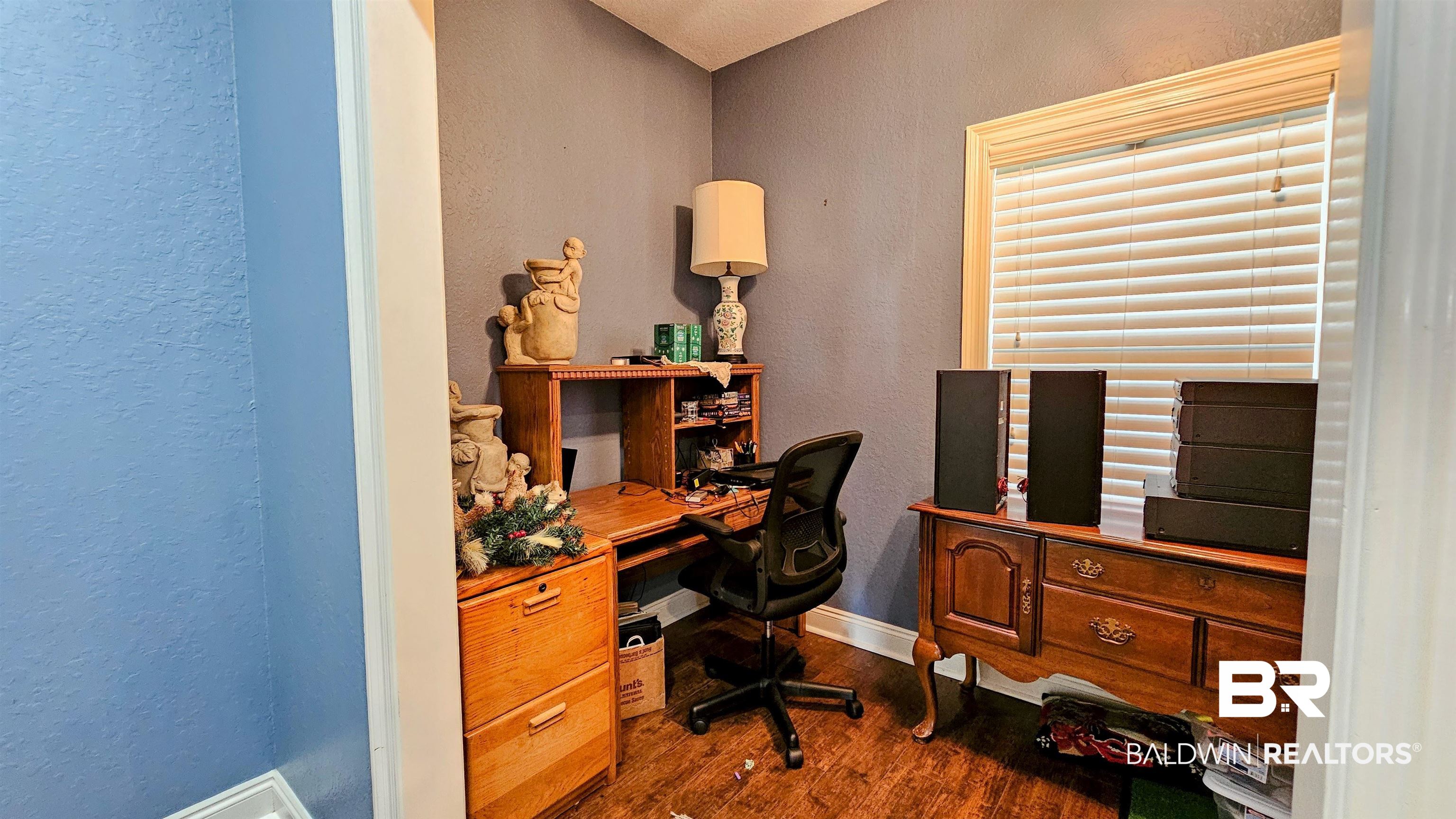 9275 Crawford Road Elberta, AL 36530 - Photo 21 of 28 Home office with a textured wall and dark wood-style floors