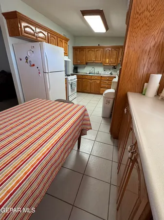 a kitchen with stainless steel appliances granite countertop a refrigerator sink and cabinets