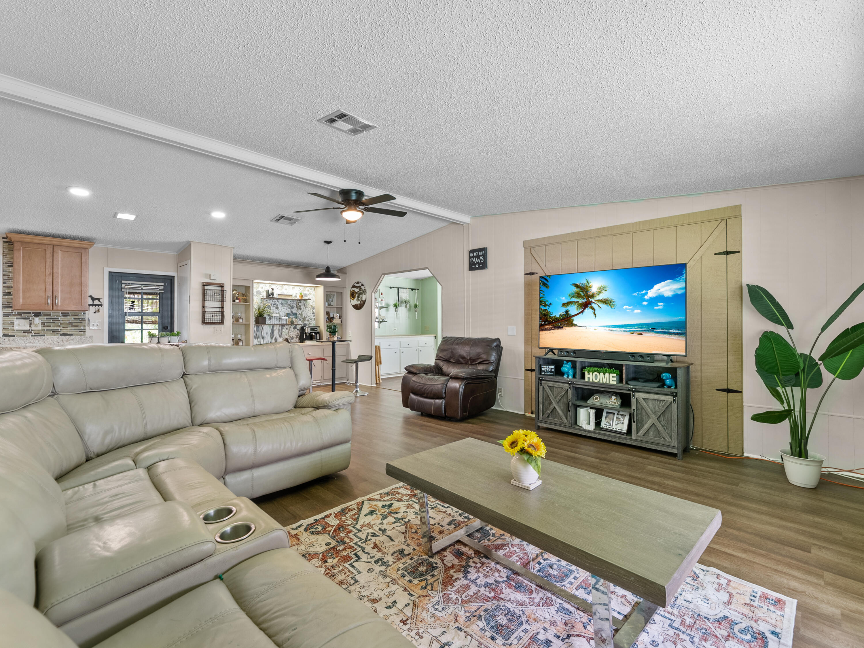 2855 Southwest Monarch Trail Stuart, FL 34997 - Photo 11 of 37 a living room with furniture and a flat screen tv