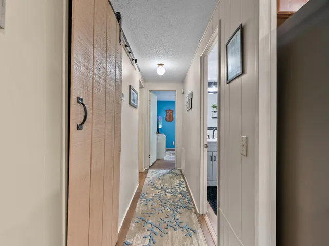 a view of a hallway view with staircase