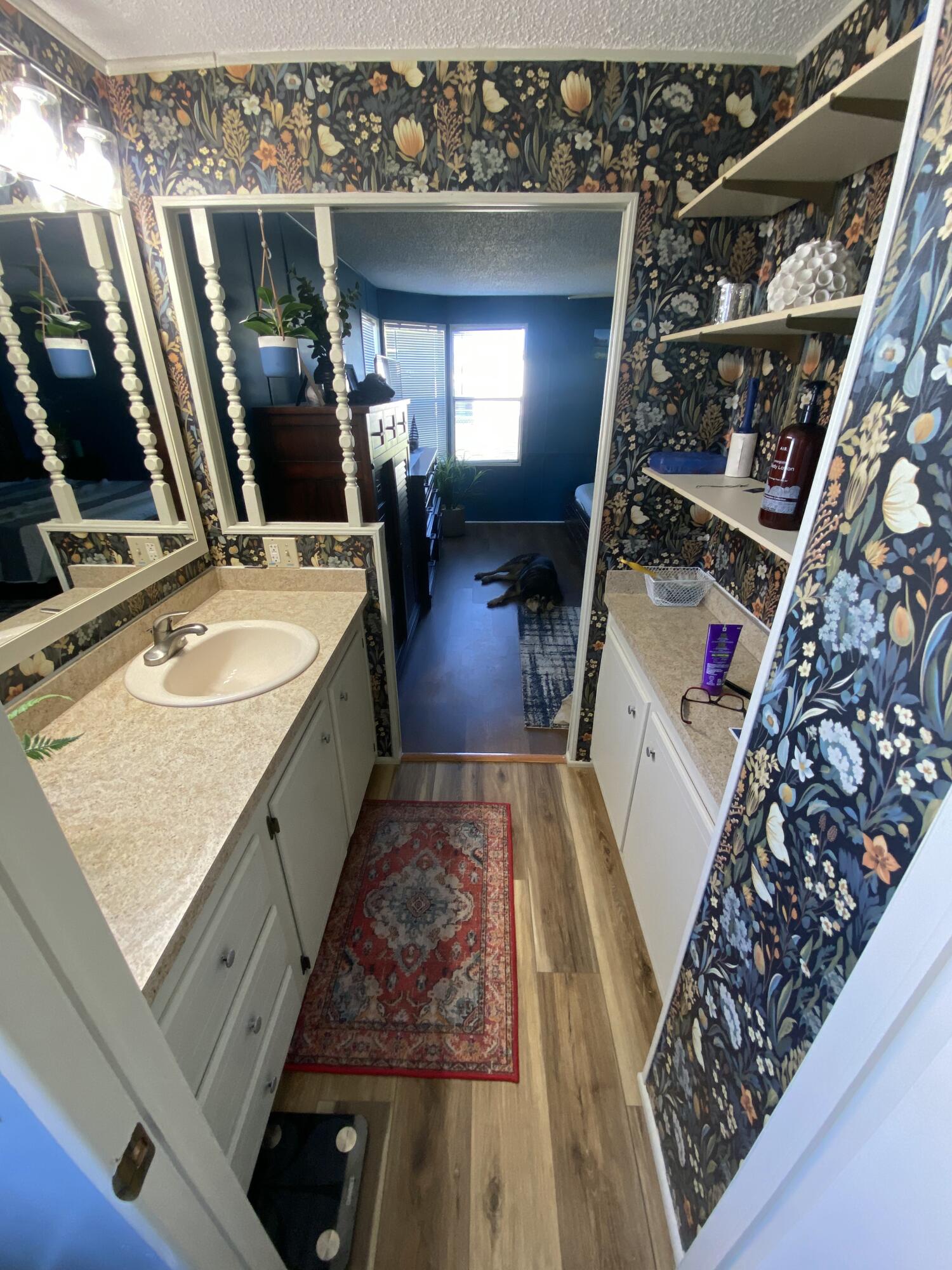2855 Southwest Monarch Trail Stuart, FL 34997 - Photo 24 of 37 a bathroom with a sink and a mirror