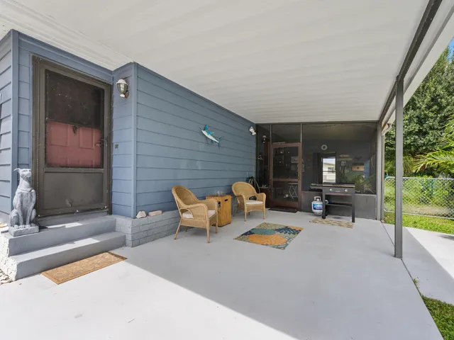 a outdoor space with patio the couch and a fireplace