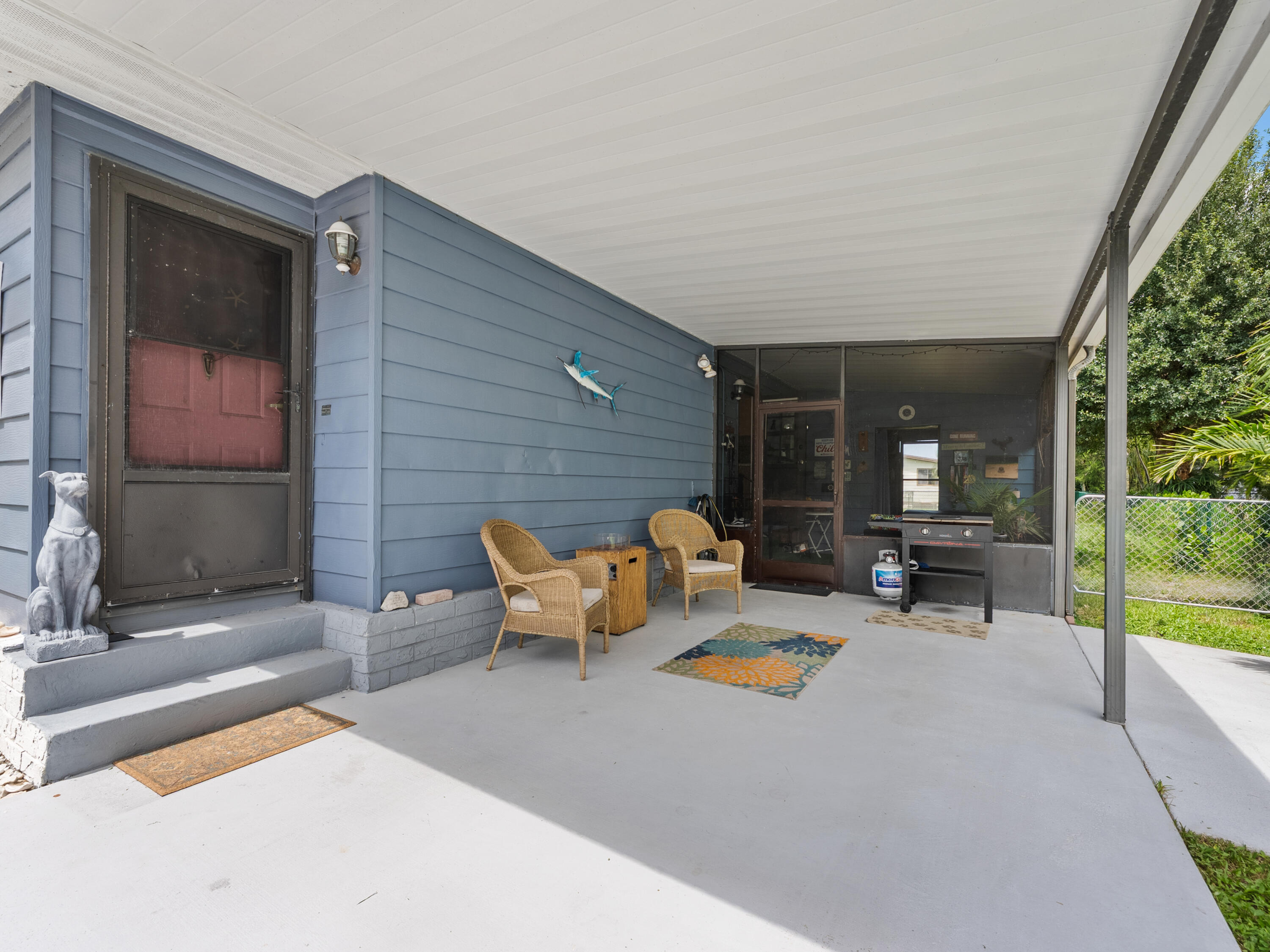 2855 Southwest Monarch Trail Stuart, FL 34997 - Photo 35 of 37 a outdoor space with patio the couch and a fireplace
