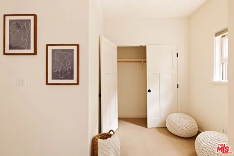 a view of room with furniture and wooden floor