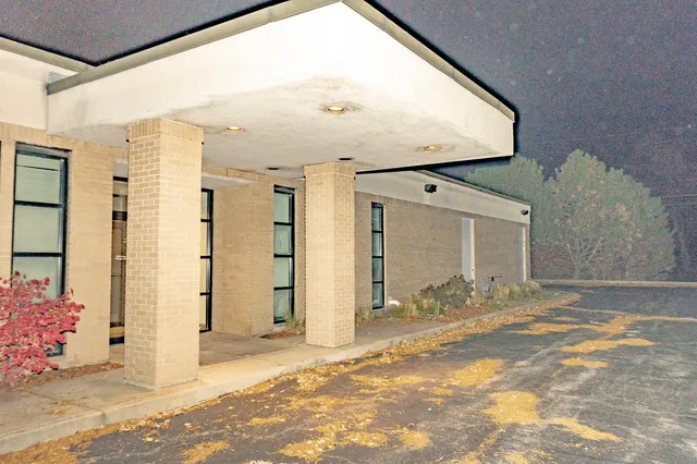 a view of a back yard of the building