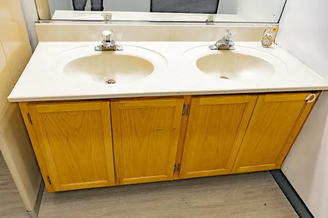 a bedroom with a bed and a table in it