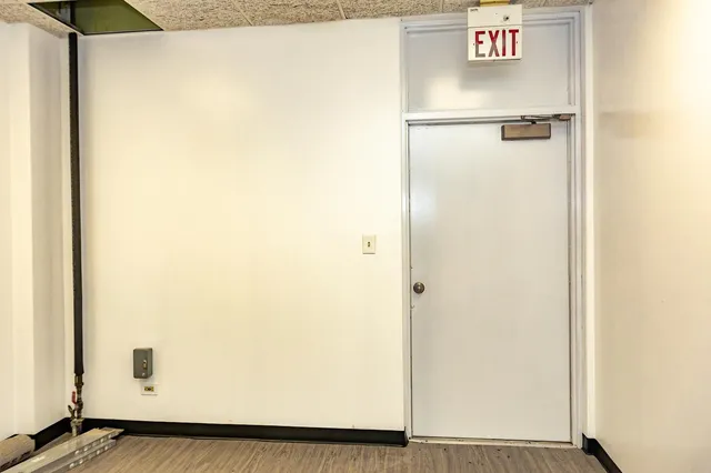 a bedroom with furniture and wooden floor