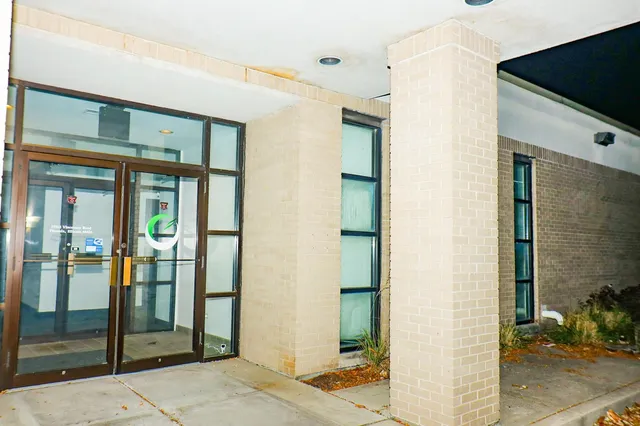a bathroom with a shower and a sink