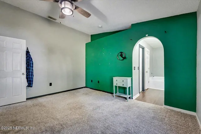 a view of a livingroom with a staircase