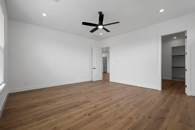 a bathroom with a tub sink shower and mirror