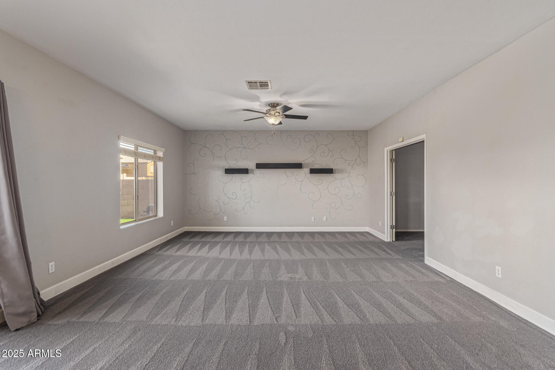 17868 West Charter Oak Road Surprise, AZ 85388 - Photo 17 of 67 wooden floor in an empty room with a window