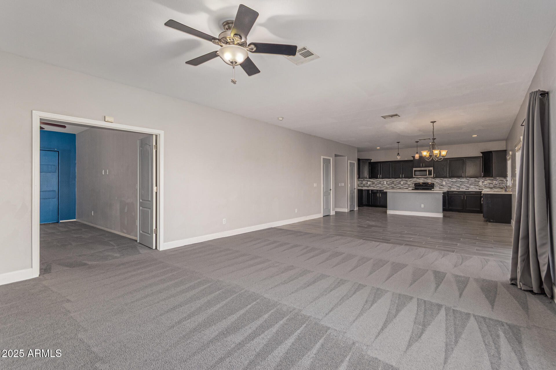 17868 West Charter Oak Road Surprise, AZ 85388 - Photo 19 of 67 a view of a kitchen with a sink and a refrigerator