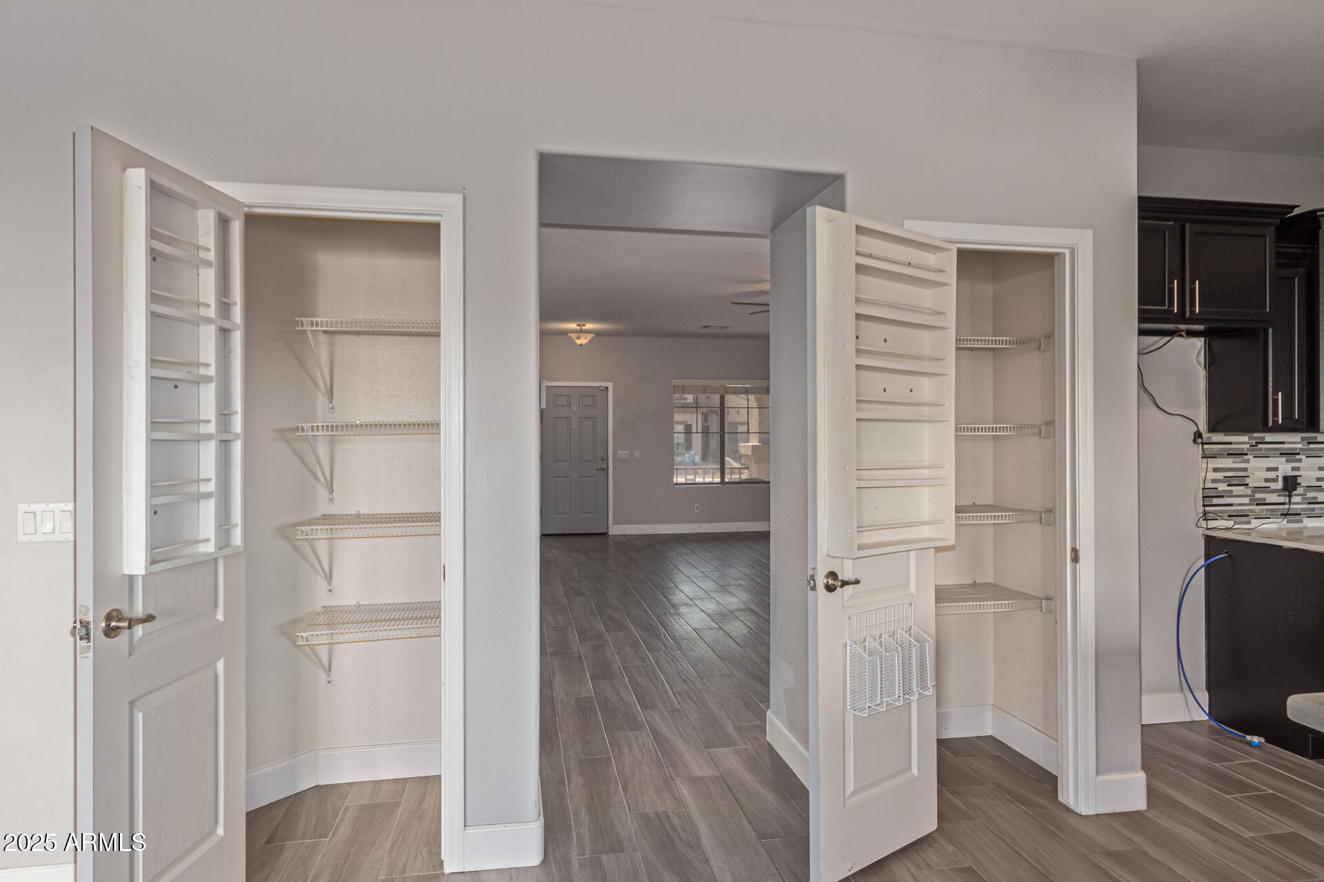 17868 West Charter Oak Road Surprise, AZ 85388 - Photo 25 of 67 a view of a hallway with wooden floor and closet