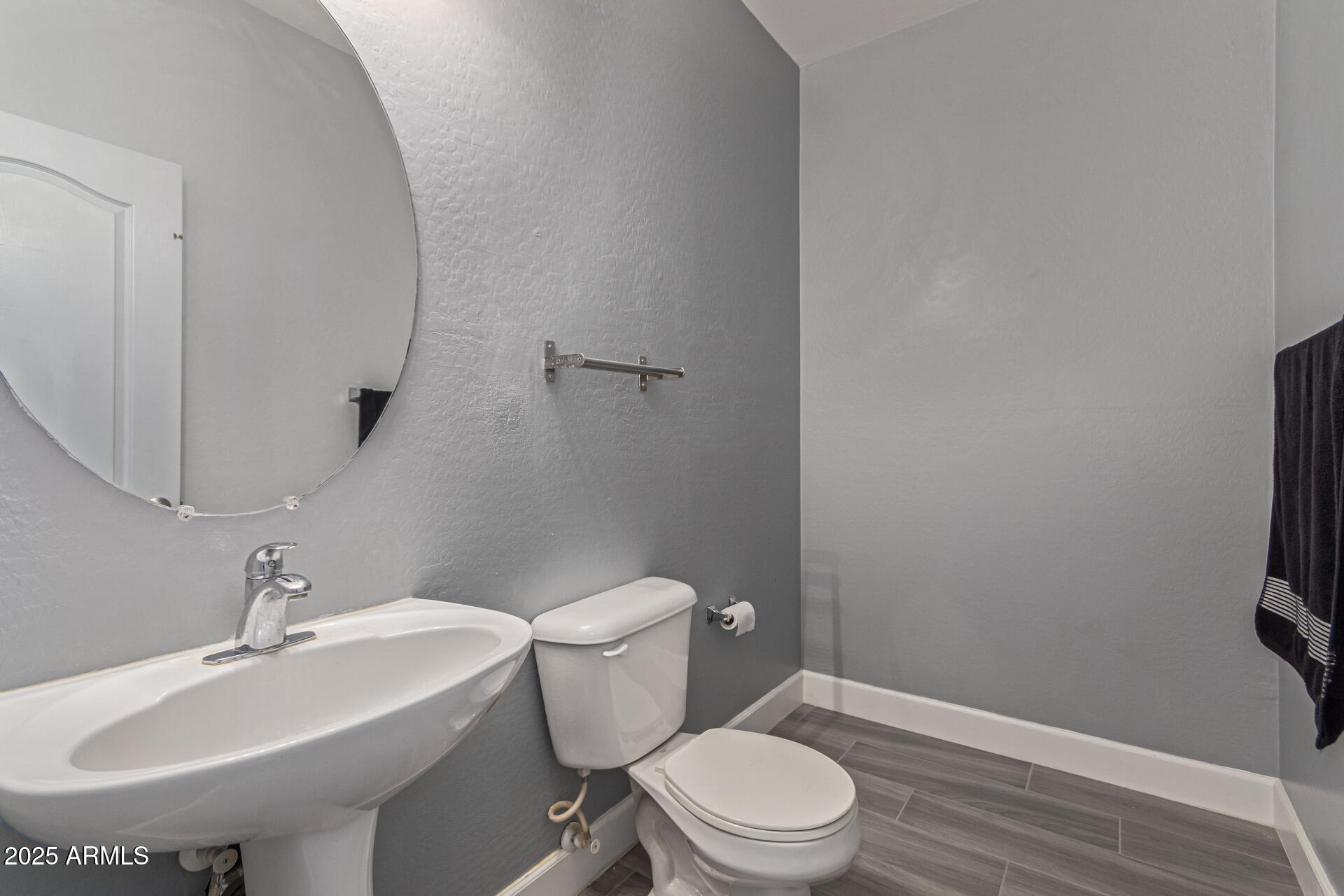 17868 West Charter Oak Road Surprise, AZ 85388 - Photo 26 of 67 a bathroom with a sink toilet and a mirror