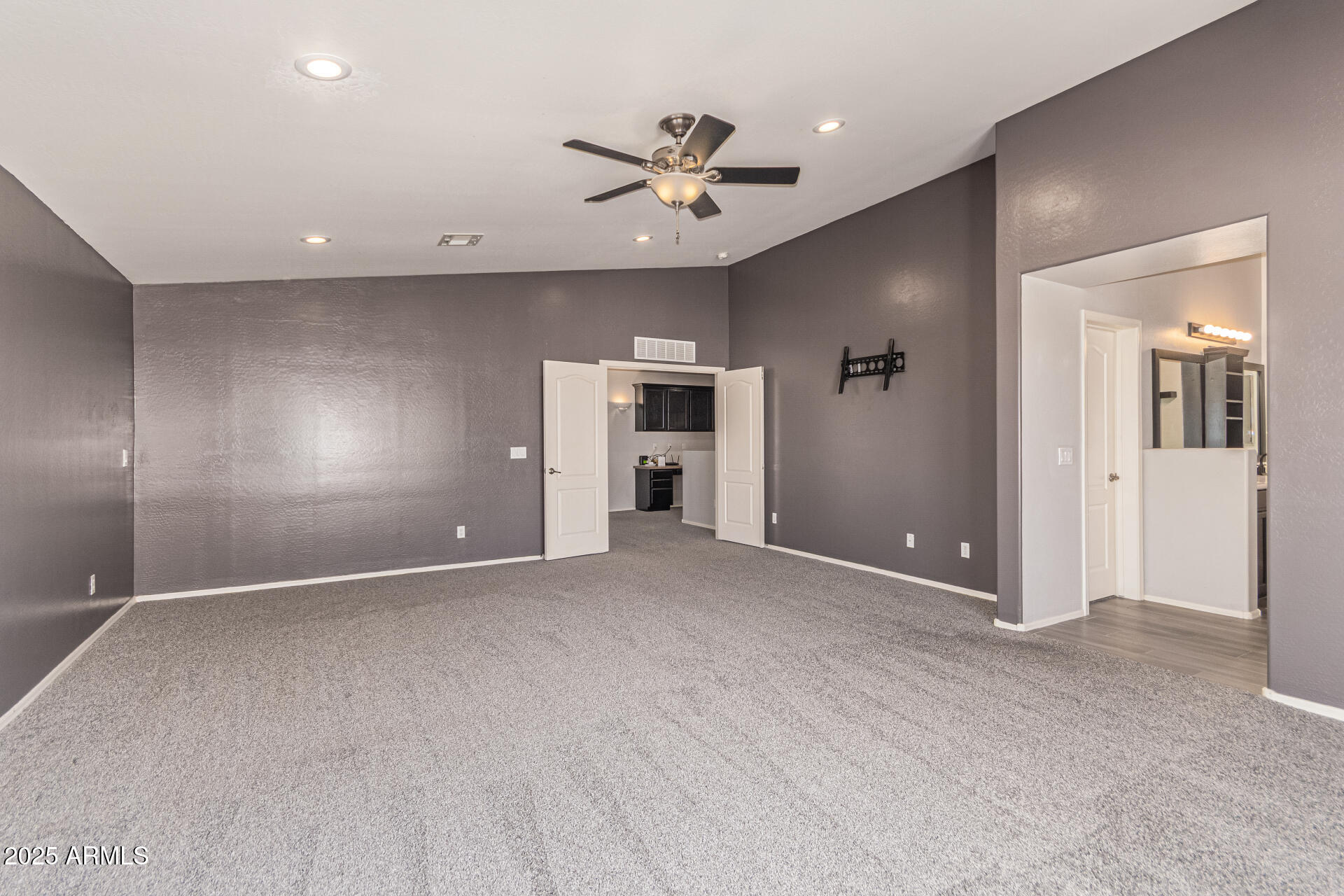 17868 West Charter Oak Road Surprise, AZ 85388 - Photo 30 of 67 a view of an empty room and a ceiling fan