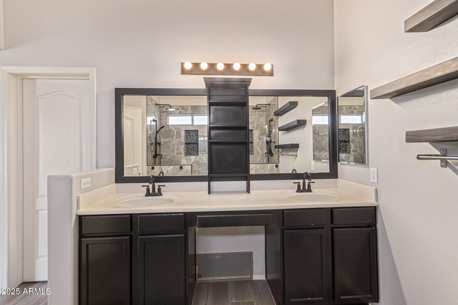 17868 West Charter Oak Road Surprise, AZ 85388 - Photo 31 of 67 a bathroom with a double vanity sink and mirror