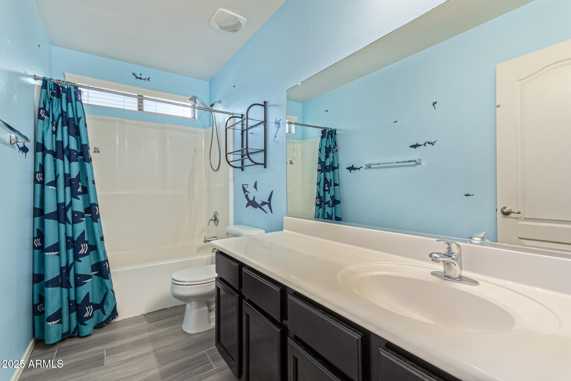 17868 West Charter Oak Road Surprise, AZ 85388 - Photo 39 of 67 a bathroom with a sink a toilet and shower