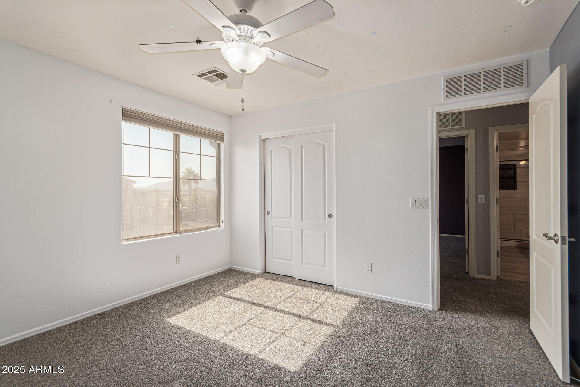 17868 West Charter Oak Road Surprise, AZ 85388 - Photo 43 of 67 a view of an empty room with a window