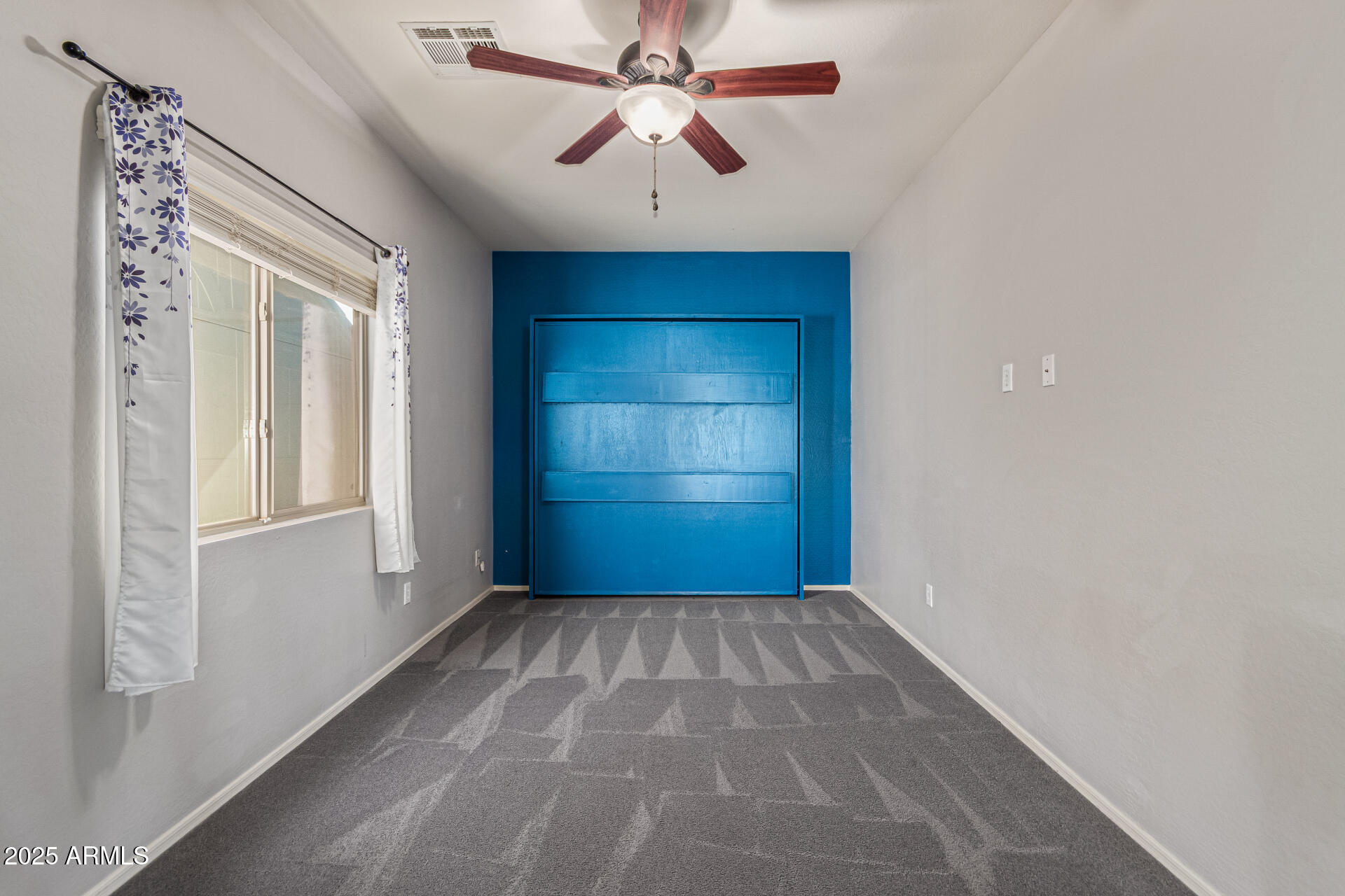 17868 West Charter Oak Road Surprise, AZ 85388 - Photo 49 of 67 wooden floor in an empty room with a window