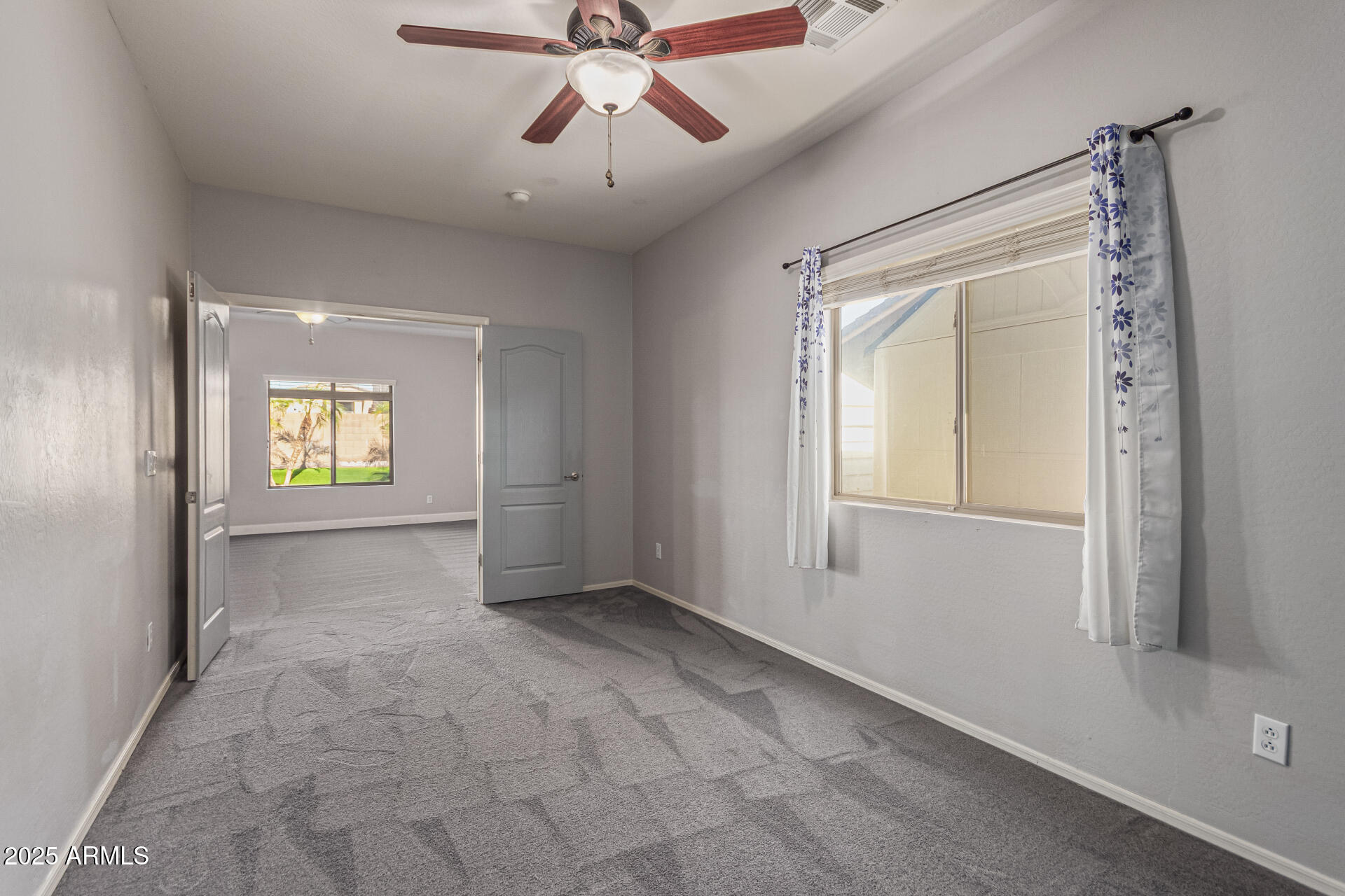 17868 West Charter Oak Road Surprise, AZ 85388 - Photo 50 of 67 a view of an empty room and window