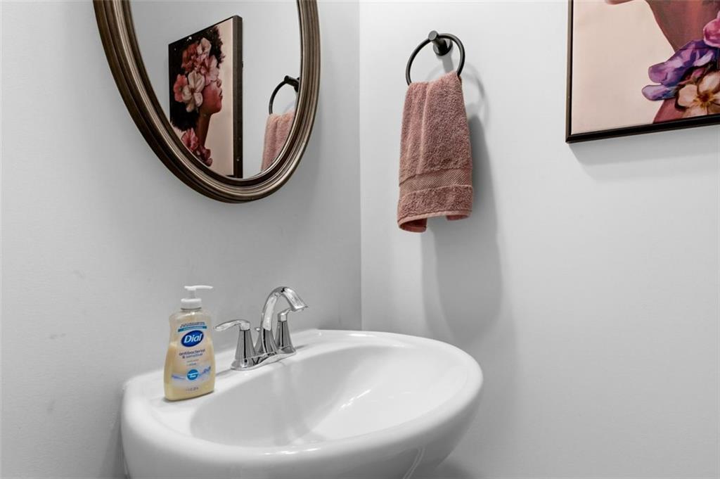 4006 Riverchess Drive Southwest Atlanta, GA 30331 - Photo 12 of 28 a bathroom with a sink and a mirror