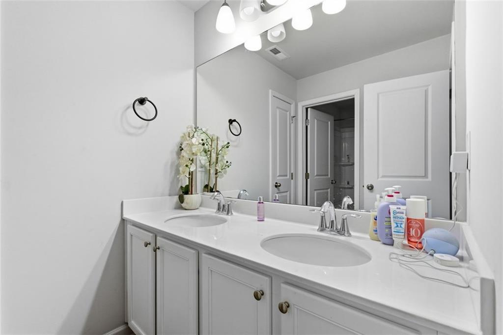 4006 Riverchess Drive Southwest Atlanta, GA 30331 - Photo 13 of 28 a bathroom with a sink and a mirror