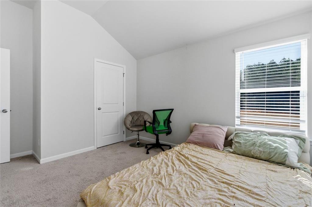 4006 Riverchess Drive Southwest Atlanta, GA 30331 - Photo 15 of 28 a bedroom with a bed and window