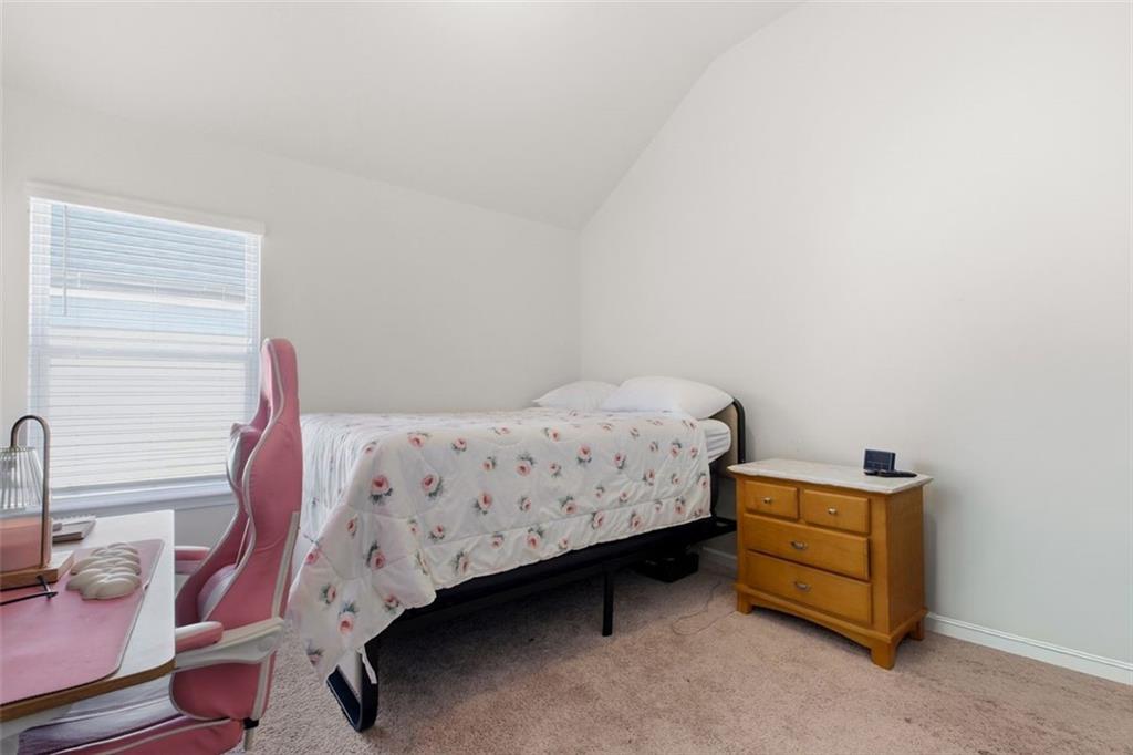 4006 Riverchess Drive Southwest Atlanta, GA 30331 - Photo 16 of 28 a bedroom with a bed and a window