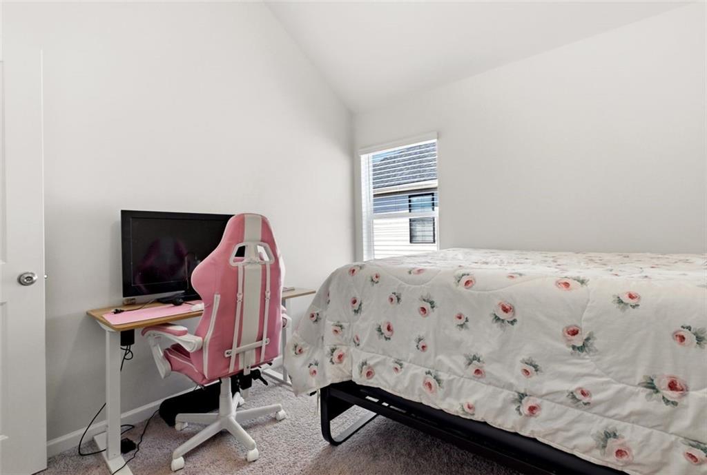 4006 Riverchess Drive Southwest Atlanta, GA 30331 - Photo 17 of 28 a bedroom with a bed and wooden floor