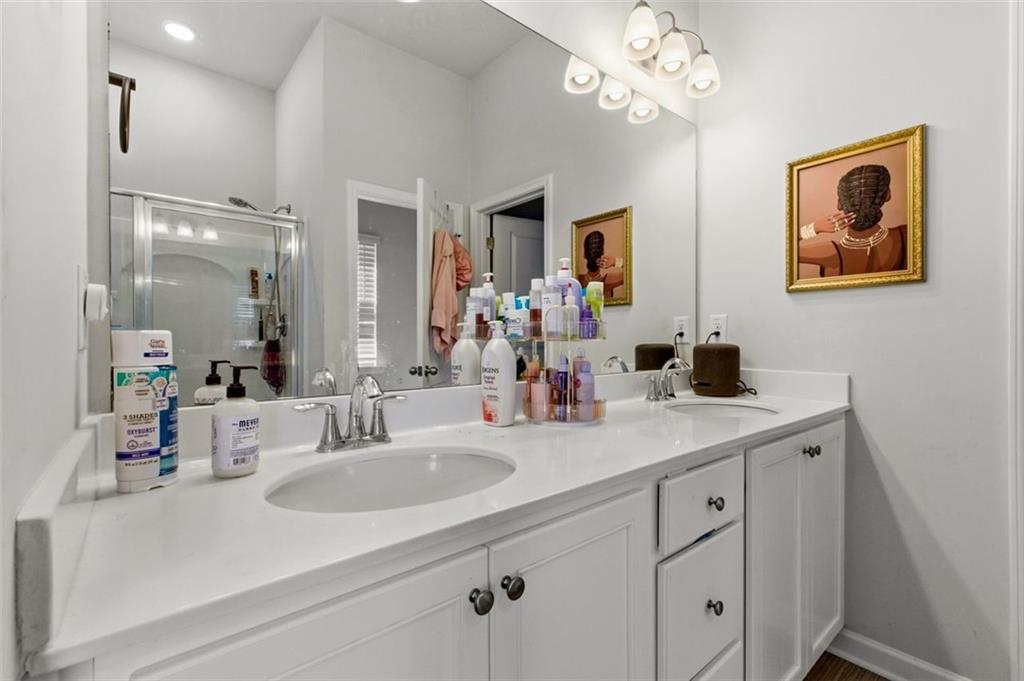 4006 Riverchess Drive Southwest Atlanta, GA 30331 - Photo 18 of 28 a bathroom with a sink double vanity and a mirror