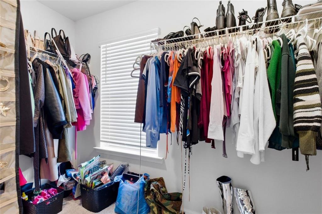 4006 Riverchess Drive Southwest Atlanta, GA 30331 - Photo 20 of 28 a view of walk in closet with clothes and shoes