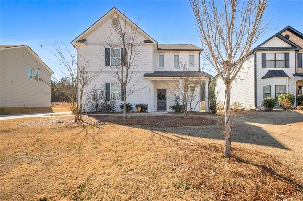 4006 Riverchess Drive Southwest Atlanta, GA 30331 - Photo 2 of 28 a front view of a house with a yard