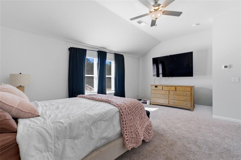 4006 Riverchess Drive Southwest Atlanta, GA 30331 - Photo 24 of 28 a bedroom with a bed and a flat screen tv