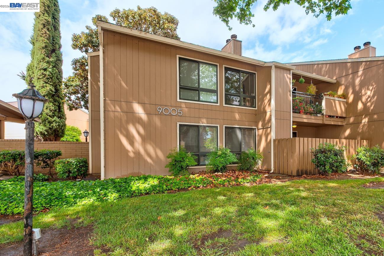 9005 Alcosta Boulevard, Unit 199 San Ramon, CA 94583 - Photo 4 of 57 a view of a house with brick walls and a yard with plants