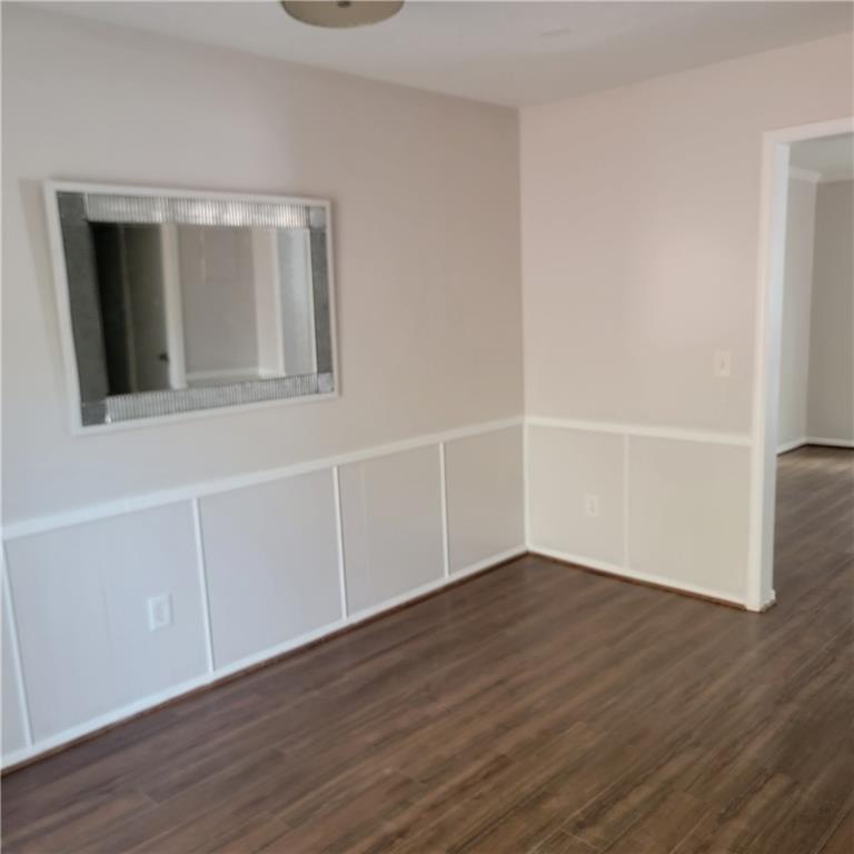 3545 Old Chamblee Tucker Road, Unit C Atlanta, GA 30340 - Photo 6 of 14 a view of an empty room with wooden floor and closet