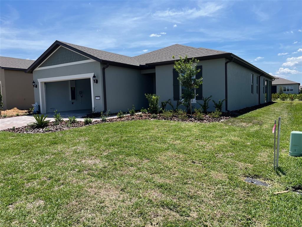 5797 Southwest 86th Ave Road Ocala, FL 34481 - Photo 1 of 1 a front view of house with yard