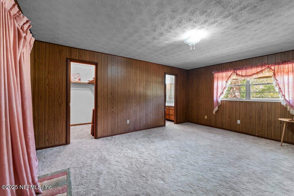 1308 Rigdon Road Jacksonville, FL 32220 - Photo 19 of 32 an empty room with windows and closet