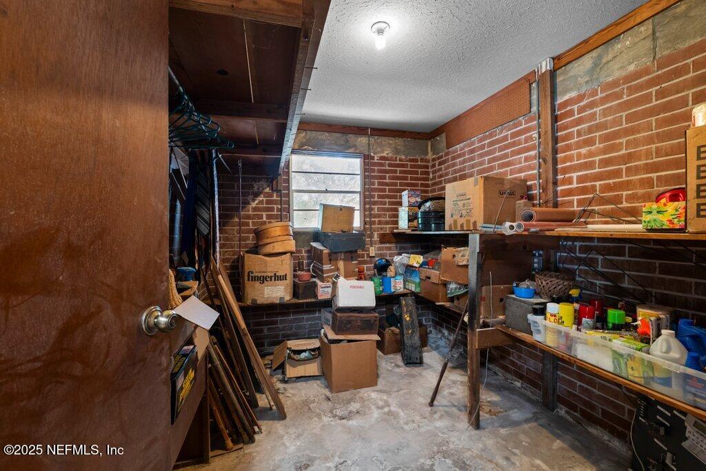 1308 Rigdon Road Jacksonville, FL 32220 - Photo 23 of 32 a room with furniture and a fireplace