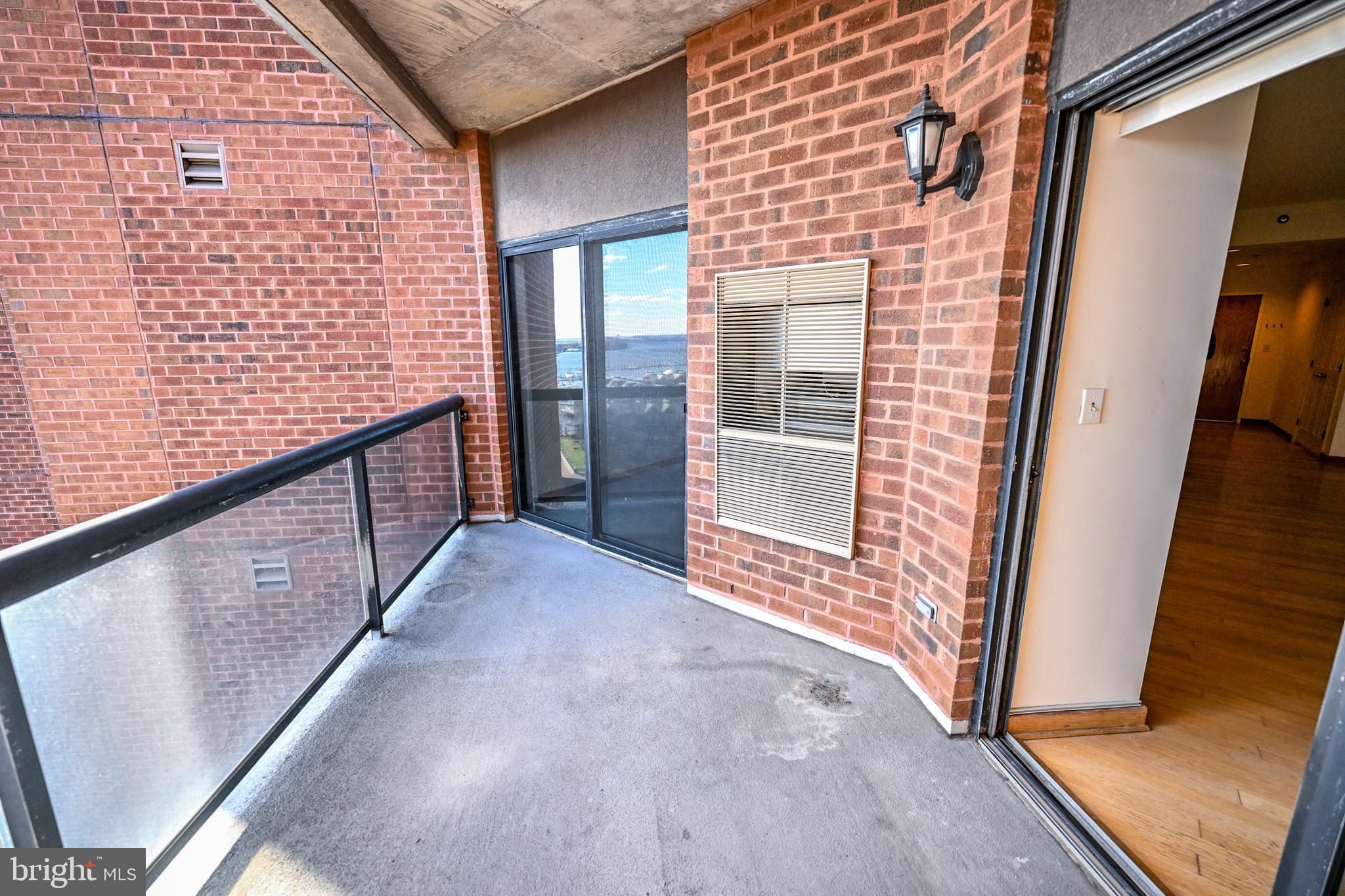 2515 Boston Street, Unit 1108 Baltimore, MD 21224 - Photo 13 of 40 a view of a brick house with an outdoor space