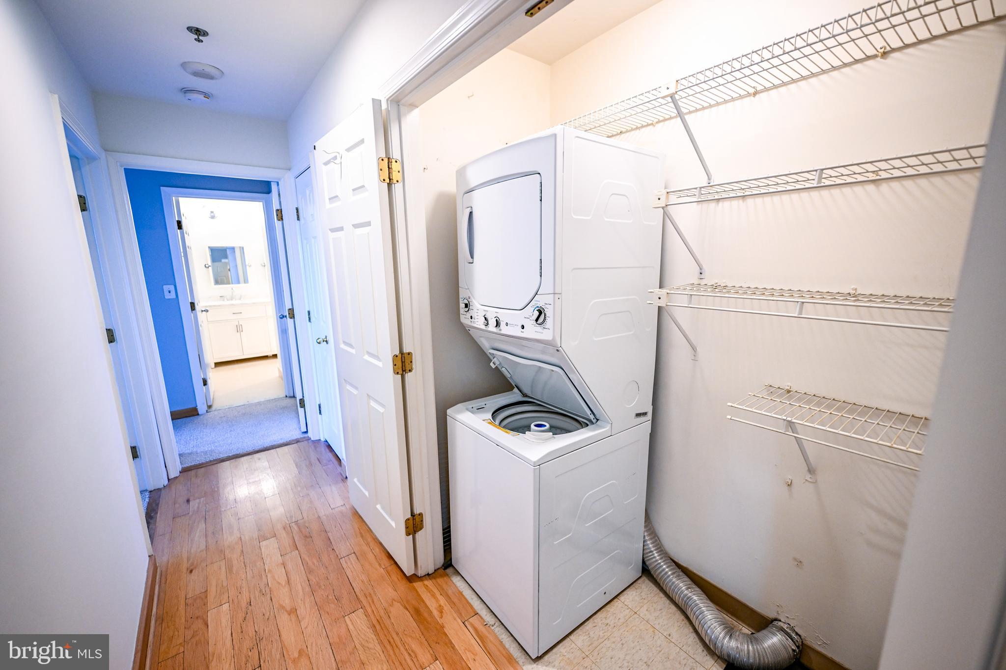 2515 Boston Street, Unit 1108 Baltimore, MD 21224 - Photo 15 of 40 a view of a storage and utility room with wooden floor