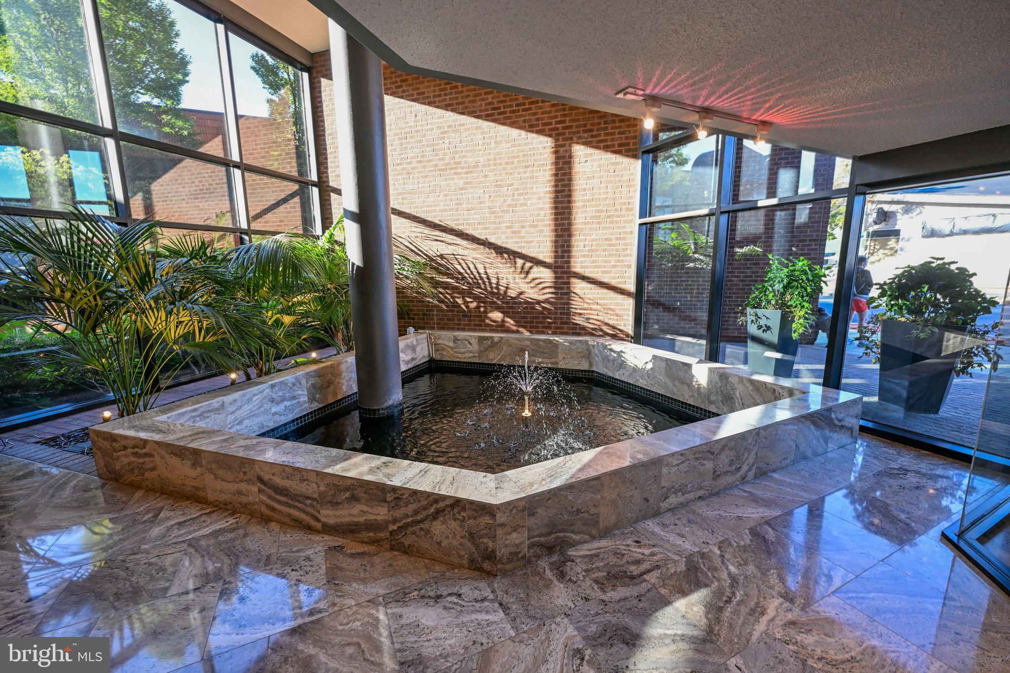 2515 Boston Street, Unit 1108 Baltimore, MD 21224 - Photo 30 of 40 a view of a living room with a floor to ceiling window and floor to ceiling window