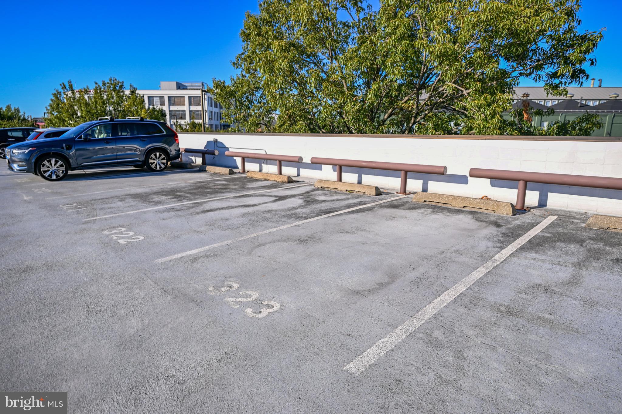 2515 Boston Street, Unit 1108 Baltimore, MD 21224 - Photo 34 of 40 a car parked on the side of the road