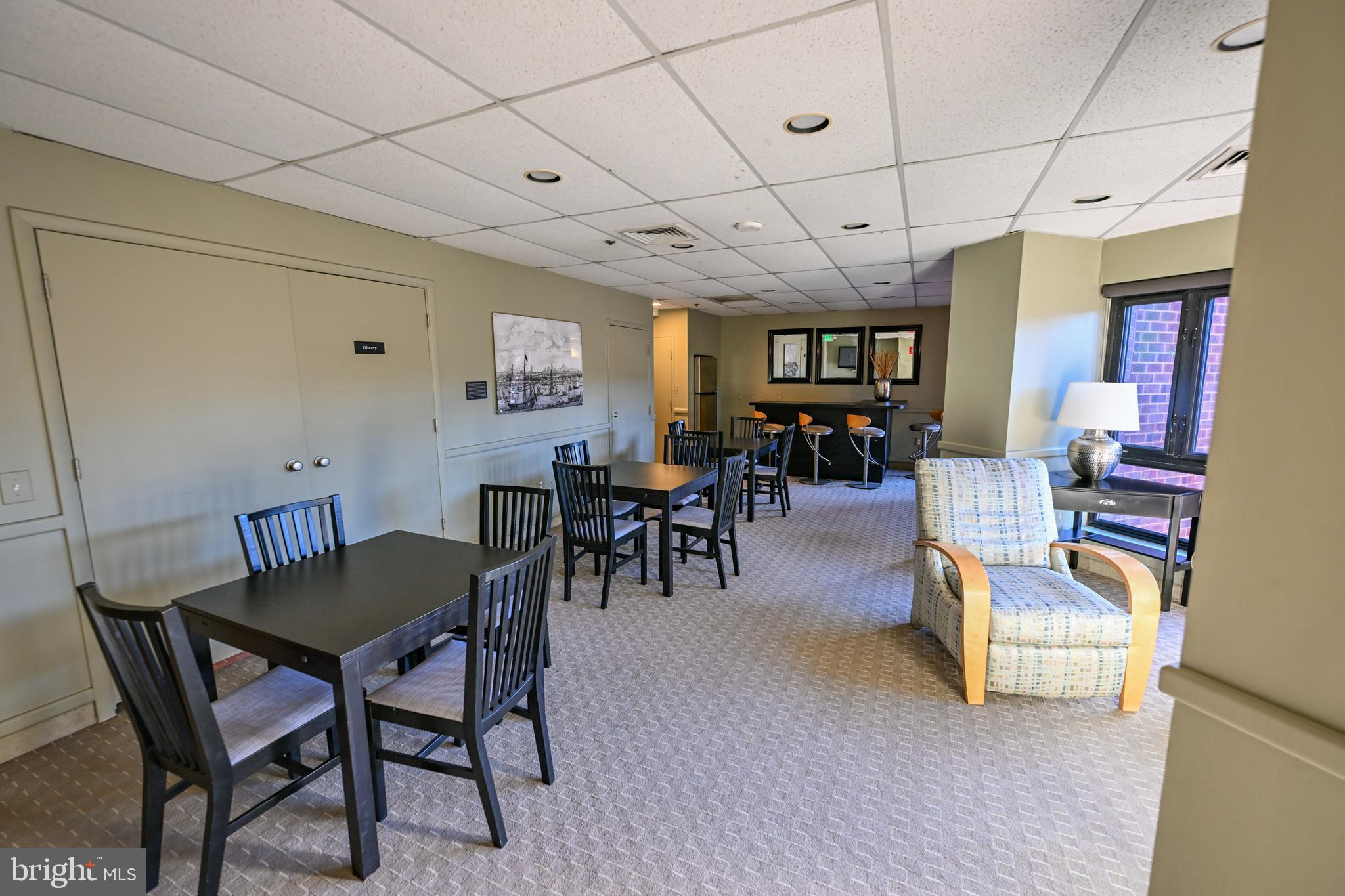 2515 Boston Street, Unit 1108 Baltimore, MD 21224 - Photo 38 of 40 a view of a dining room with furniture