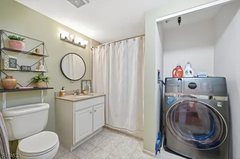 a room with gym equipment and a large mirror