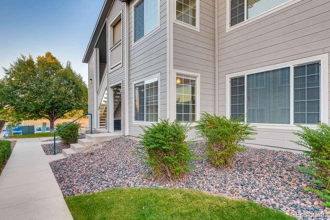 8312 Pebble Creek Way, Unit 104 Highlands Ranch, CO 80126 - Photo 1 of 12 a view of a house with a garden