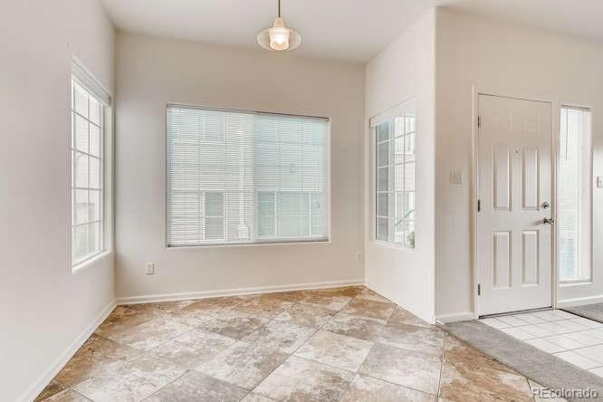 8312 Pebble Creek Way, Unit 104 Highlands Ranch, CO 80126 - Photo 3 of 12 an empty room with windows