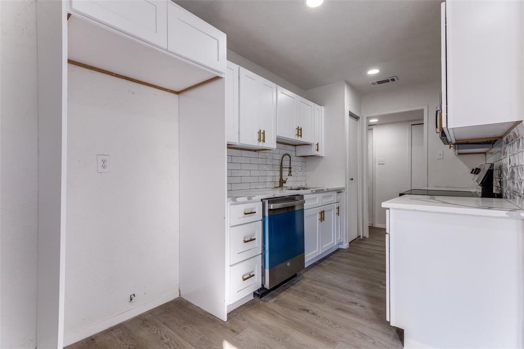4108 Bristlecone Lane Fort Worth, TX 76137 - Photo 10 of 25 a kitchen with stainless steel appliances a refrigerator and a stove top oven