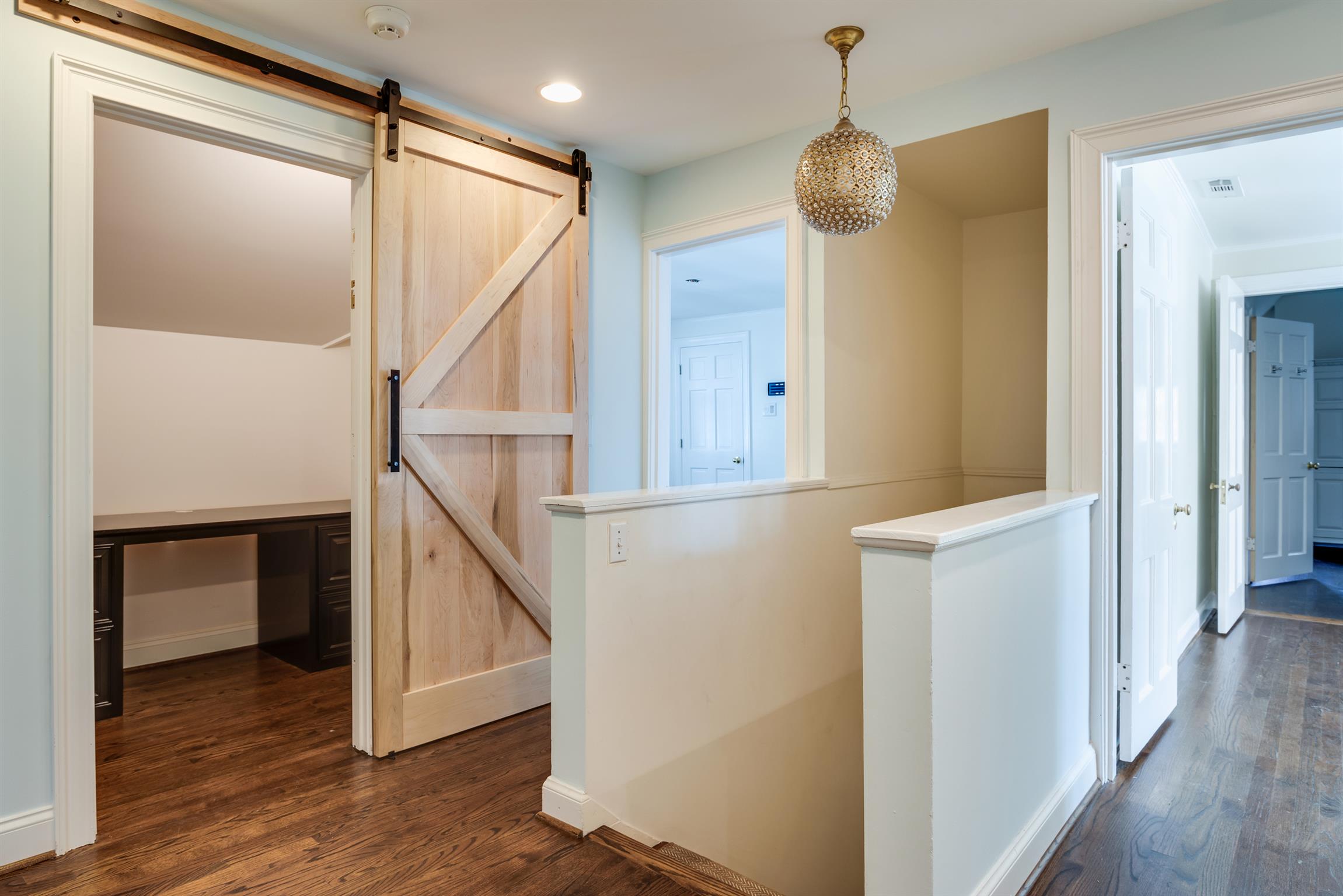3904 Valley Road Nashville, TN 37205 - Photo 15 of 25 a hallway with stairs and wooden floor